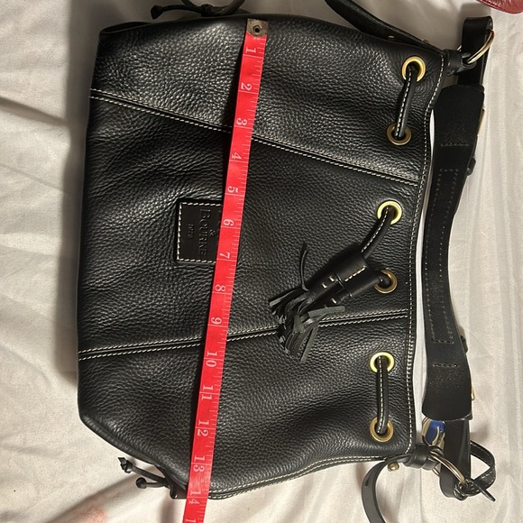 Dooney & Bourke Drawstring bag with tassels and duck tag. - Picture 3 of 12